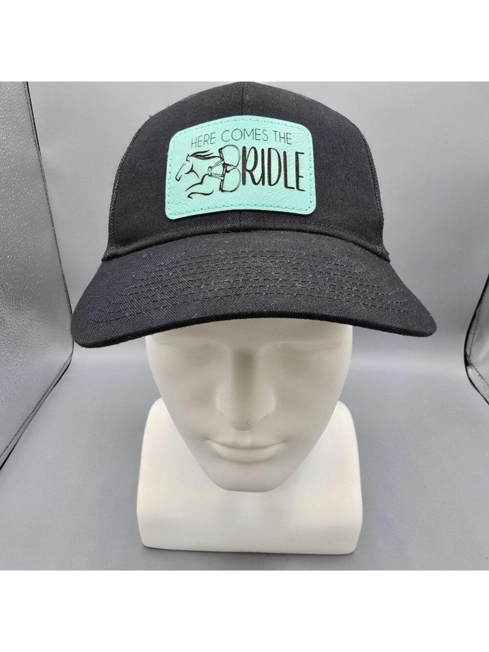Here Comes The Bridle Port Authority Low-Profile Black Patch Logo Trucker Hat